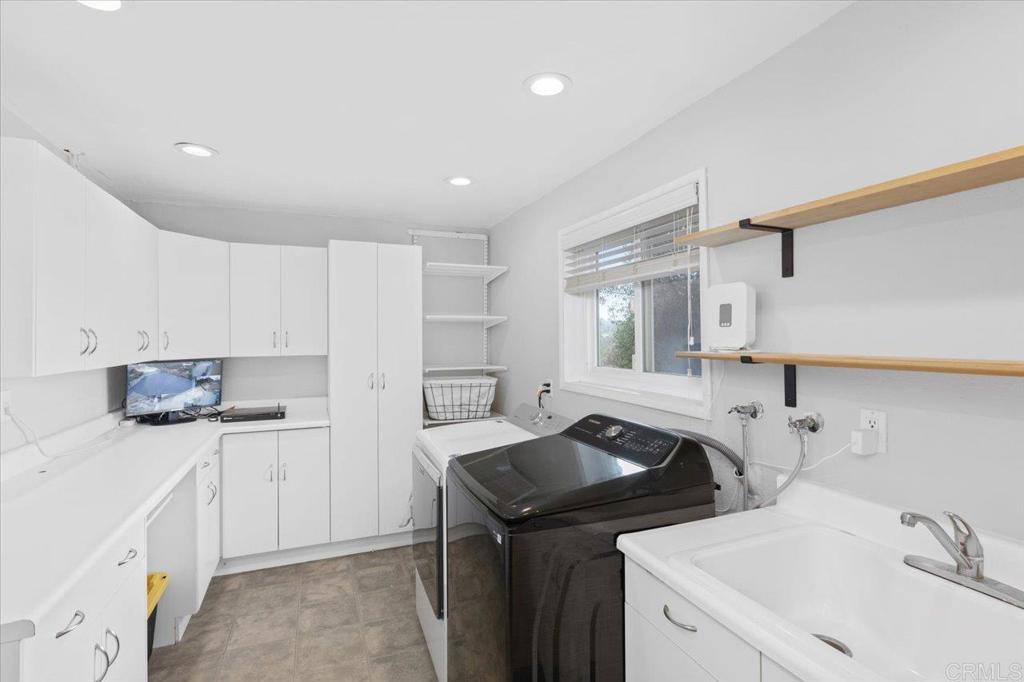 32460 Lilac Road Valley Center, CA 92082 - Photo 27 of 45 a kitchen with a sink stove and cabinets