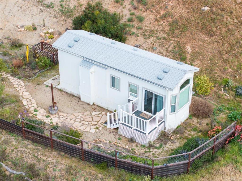 32460 Lilac Road Valley Center, CA 92082 - Photo 29 of 45 a view of a house with roof yard and lake view