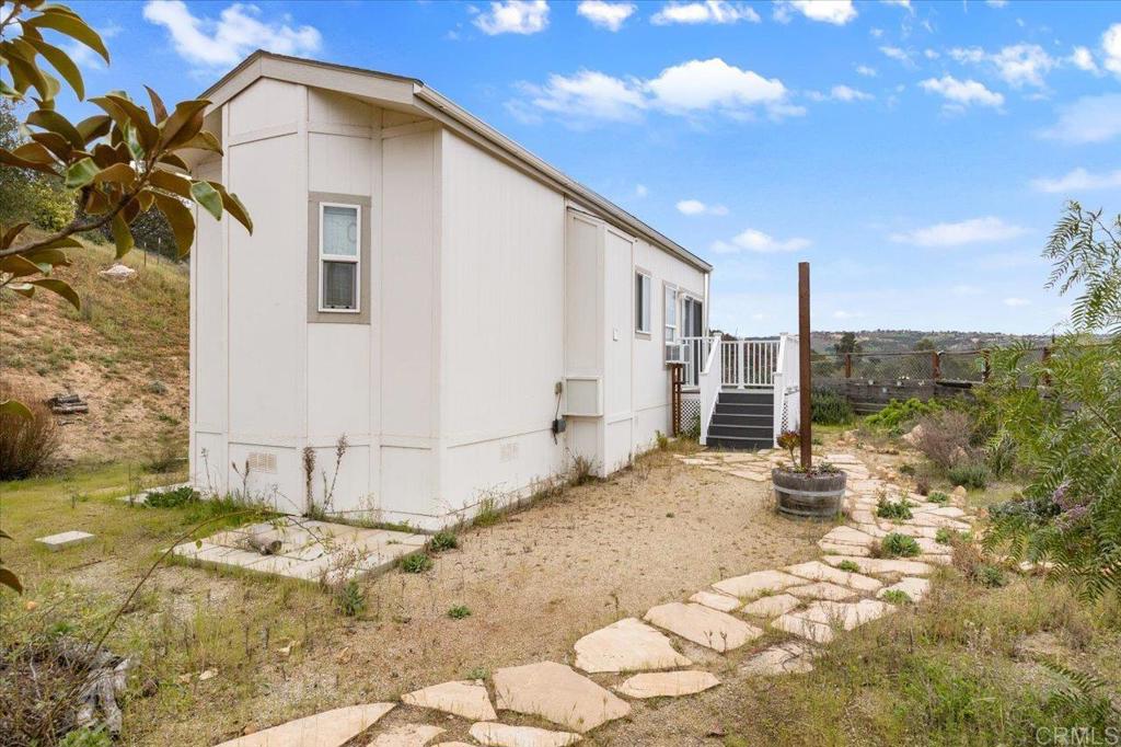32460 Lilac Road Valley Center, CA 92082 - Photo 30 of 45 a view of a house with a patio