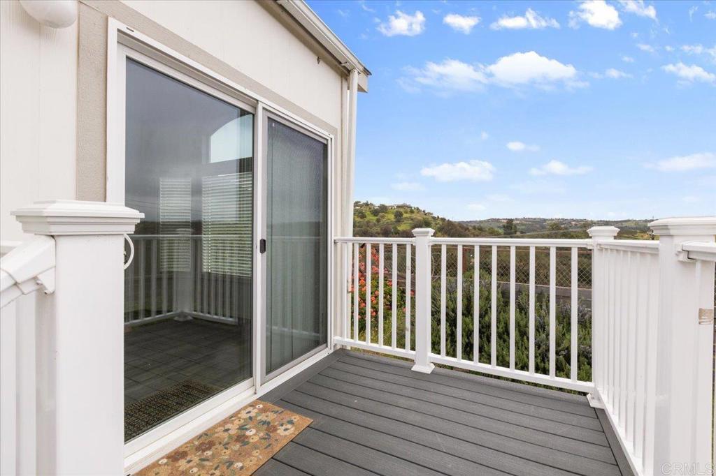 32460 Lilac Road Valley Center, CA 92082 - Photo 31 of 45 a view of a wooden deck besides a house
