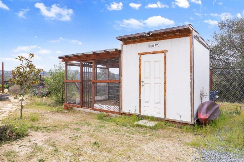 32460 Lilac Road Valley Center, CA 92082 - Photo 38 of 45 a view of a house with a yard