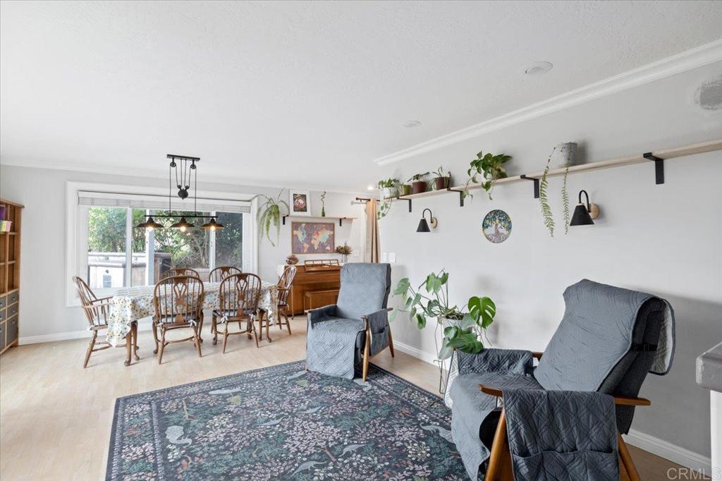 32460 Lilac Road Valley Center, CA 92082 - Photo 5 of 45 a living room with furniture and a chandelier