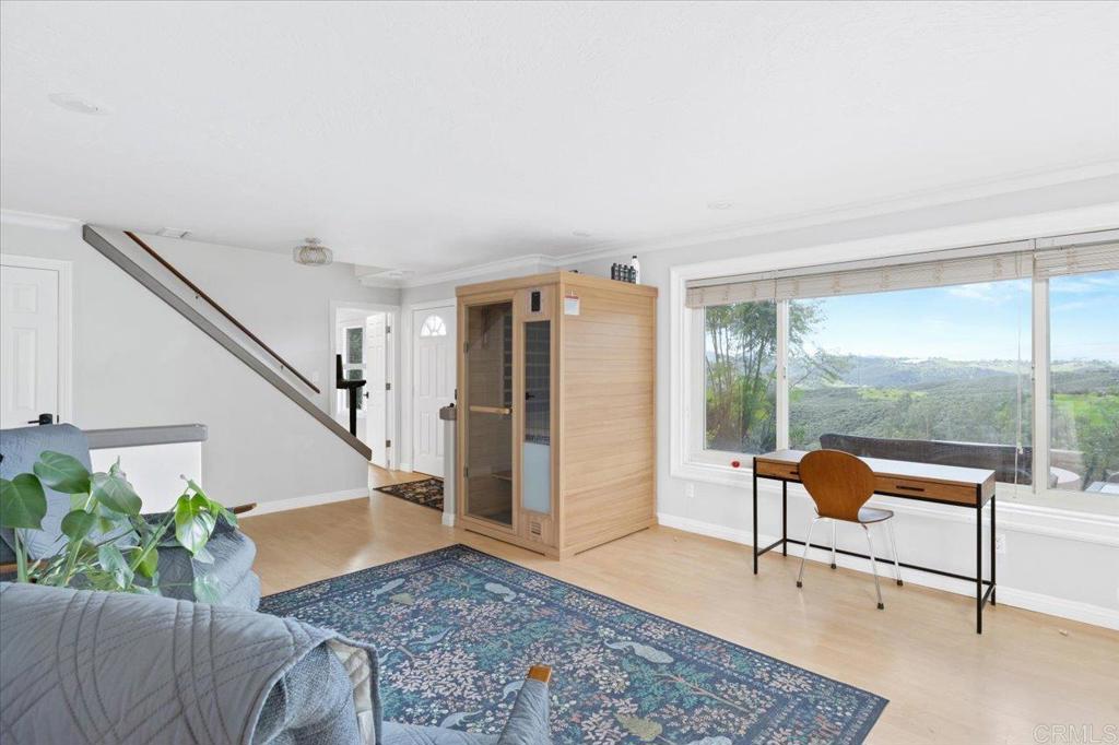 32460 Lilac Road Valley Center, CA 92082 - Photo 6 of 45 a living room with furniture and a potted plant