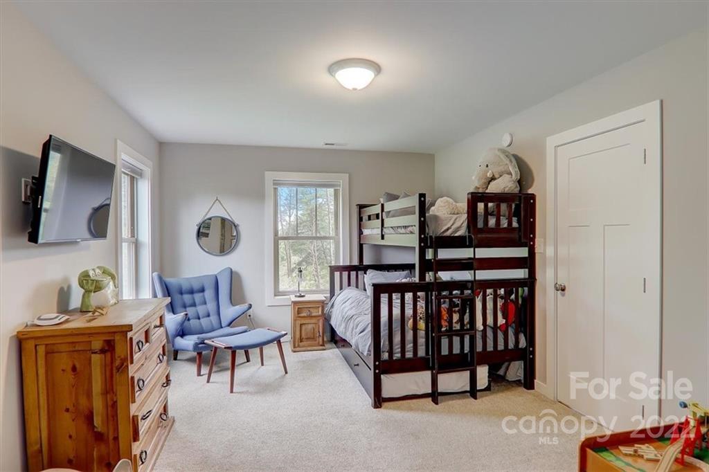 11 Ridge Brook Drive Weaverville, NC 28787 - Photo 26 of 38 a bedroom with furniture and a window