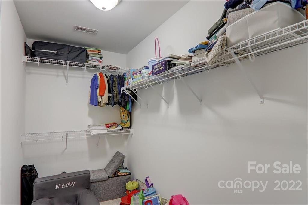 11 Ridge Brook Drive Weaverville, NC 28787 - Photo 27 of 38 a view of walk in closet with clothes and shoes