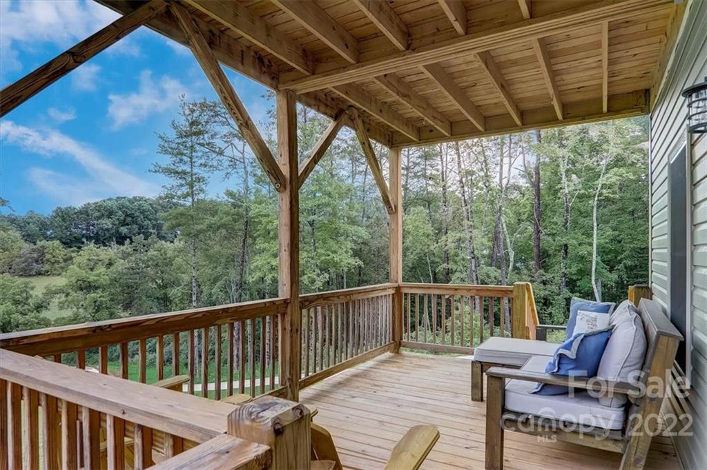 11 Ridge Brook Drive Weaverville, NC 28787 - Photo 30 of 38 a view of a chair and table on the deck