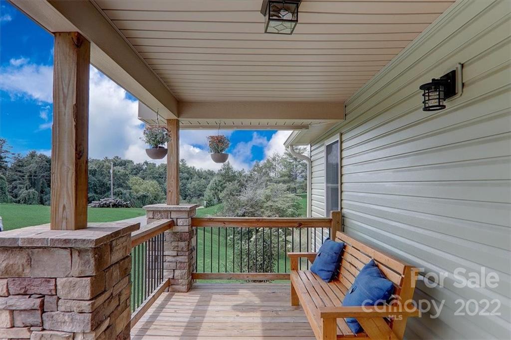 11 Ridge Brook Drive Weaverville, NC 28787 - Photo 3 of 38 a view of a porch with furniture