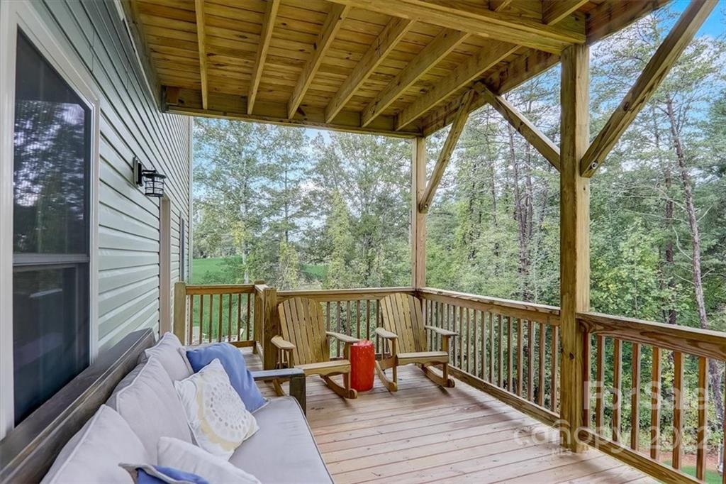 11 Ridge Brook Drive Weaverville, NC 28787 - Photo 31 of 38 a view of balcony with couch and wooden floor