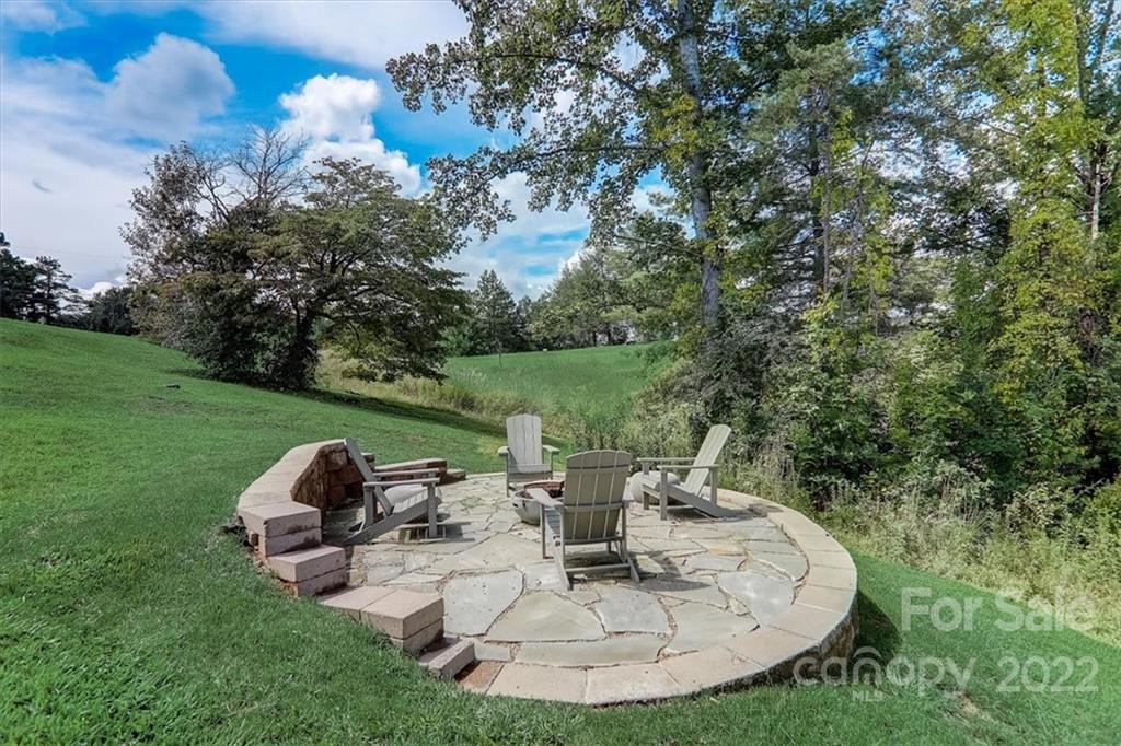 11 Ridge Brook Drive Weaverville, NC 28787 - Photo 36 of 38 a view of a chairs in a backyard