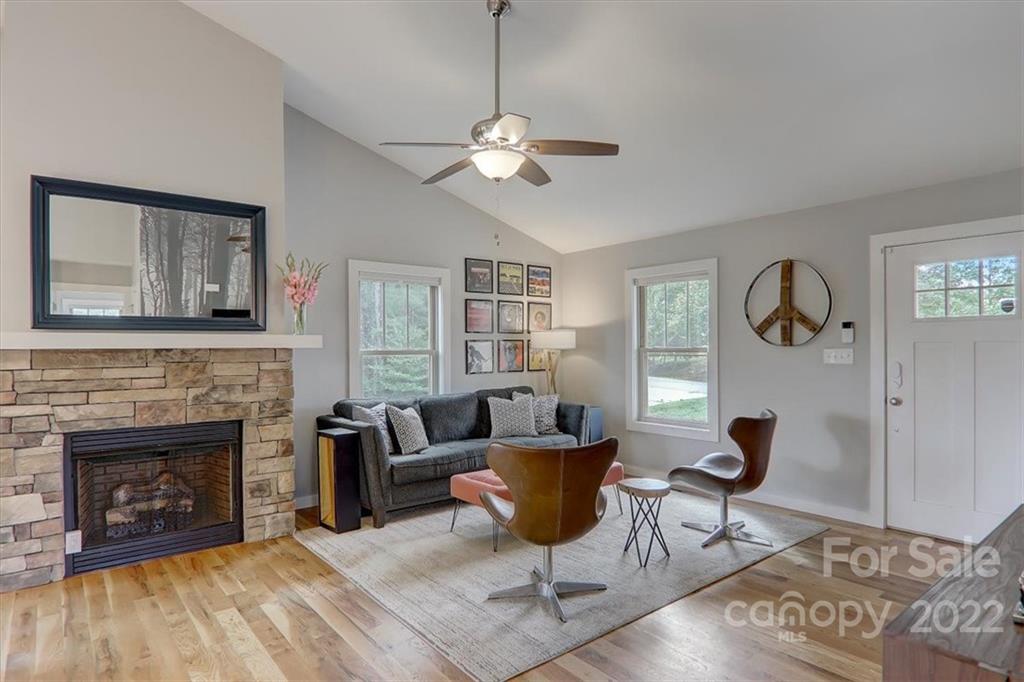 11 Ridge Brook Drive Weaverville, NC 28787 - Photo 5 of 38 a living room with furniture and a fireplace