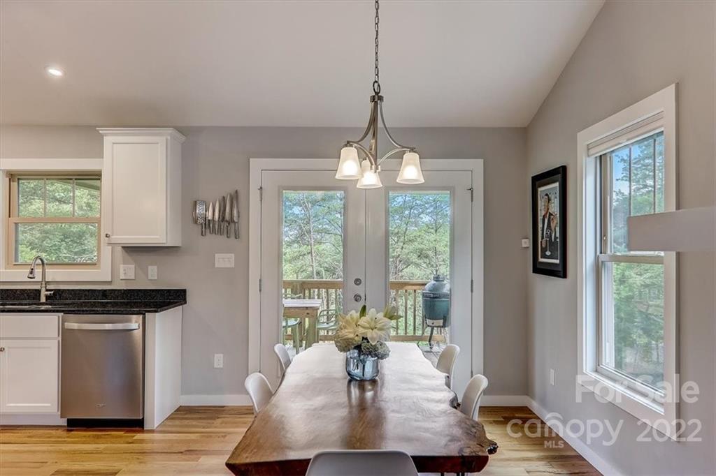 11 Ridge Brook Drive Weaverville, NC 28787 - Photo 10 of 38 a living room with kitchen island granite countertop furniture and a large window