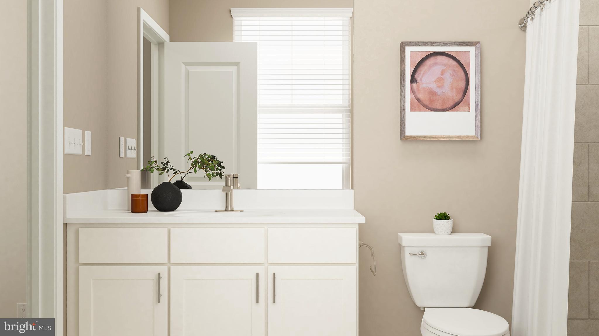 14007 Rolling Pasture Road Boyds, MD 20841 - Photo 11 of 30 a bathroom with a toilet a sink and mirror