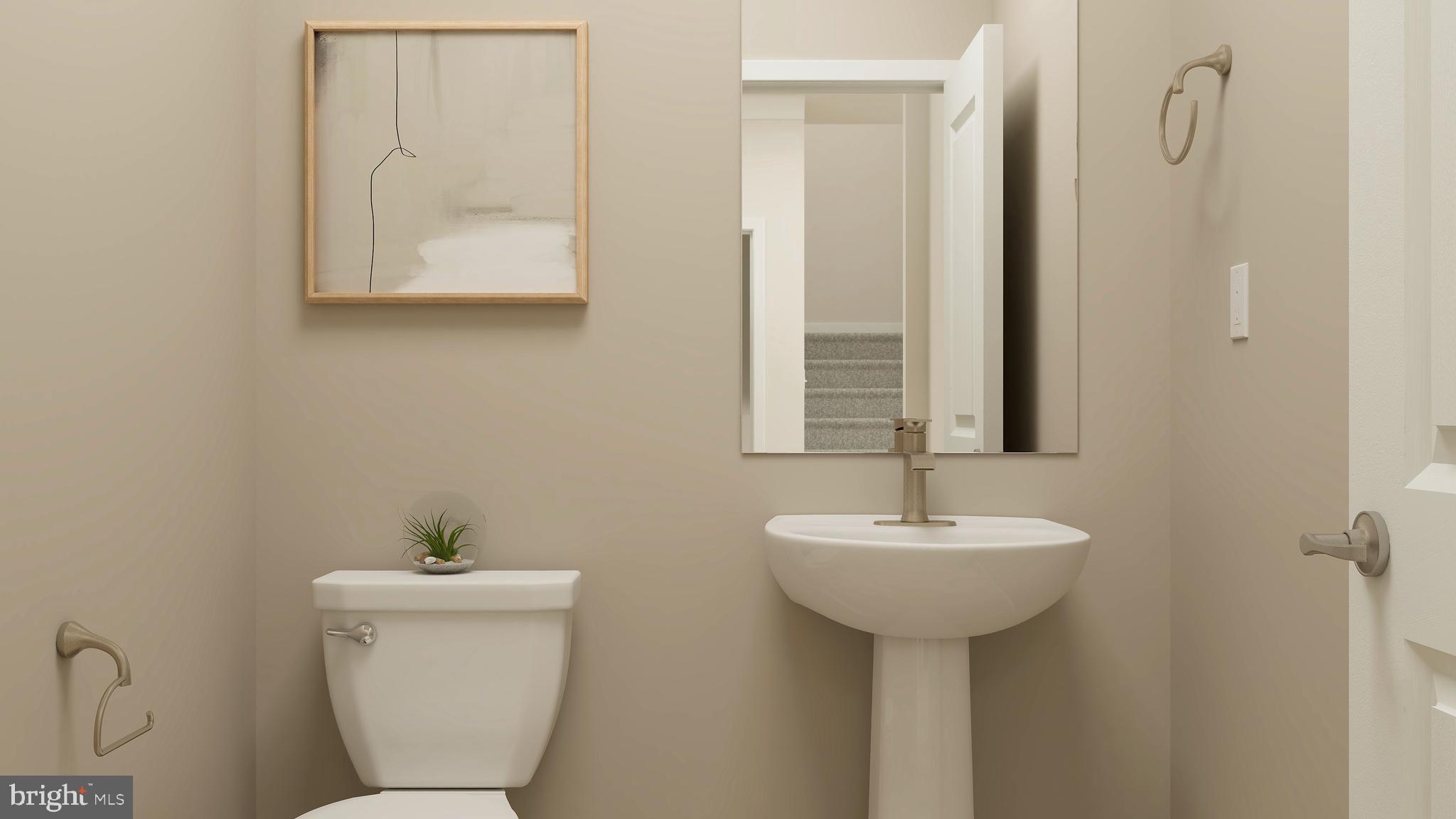 14007 Rolling Pasture Road Boyds, MD 20841 - Photo 22 of 30 a bathroom with a toilet sink and mirror