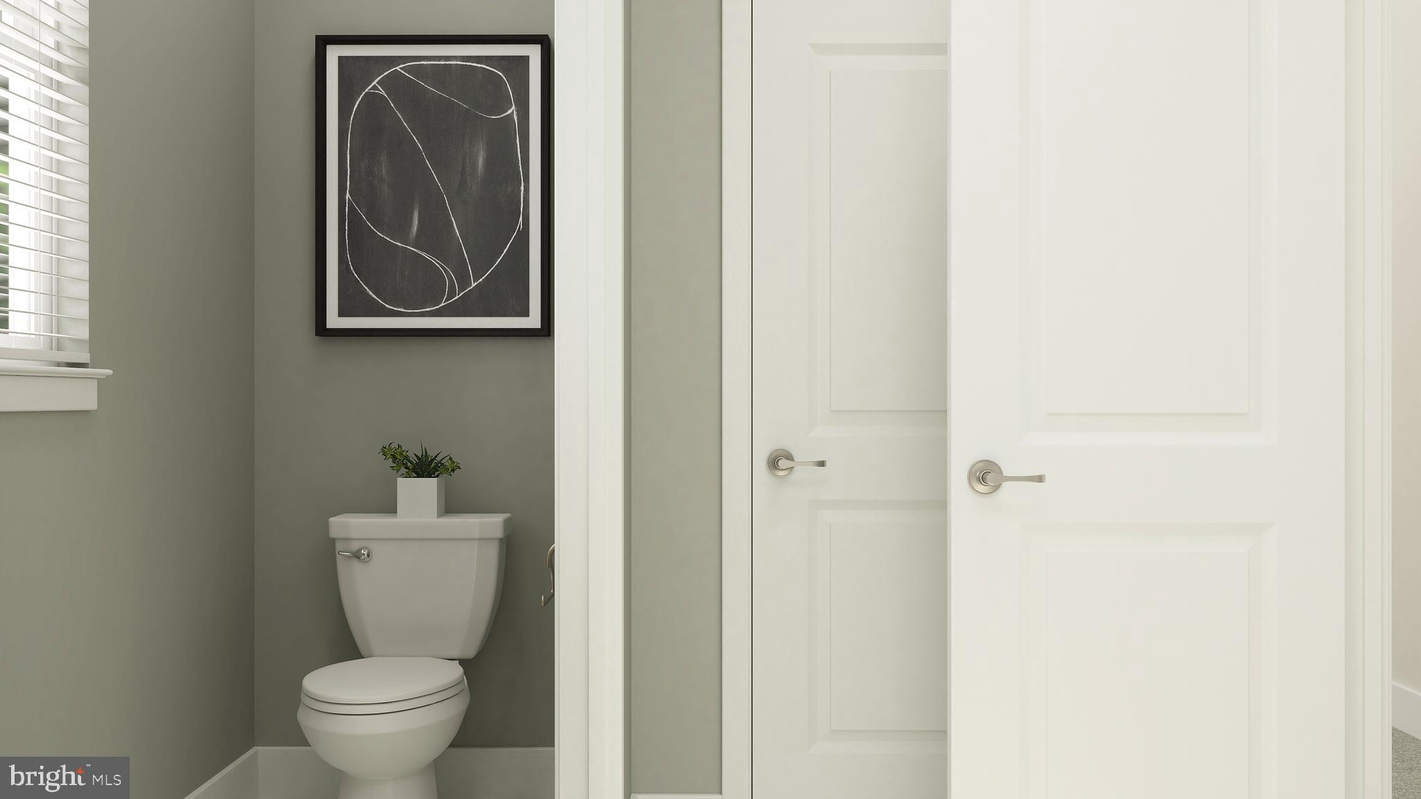 14007 Rolling Pasture Road Boyds, MD 20841 - Photo 26 of 30 a white toilet sitting next to a bathroom sink