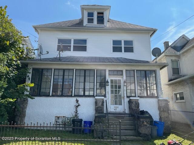 611 South Webster Avenue, Unit 1 Scranton, PA 18505 - Photo 1 of 9 a front view of a house with a yard