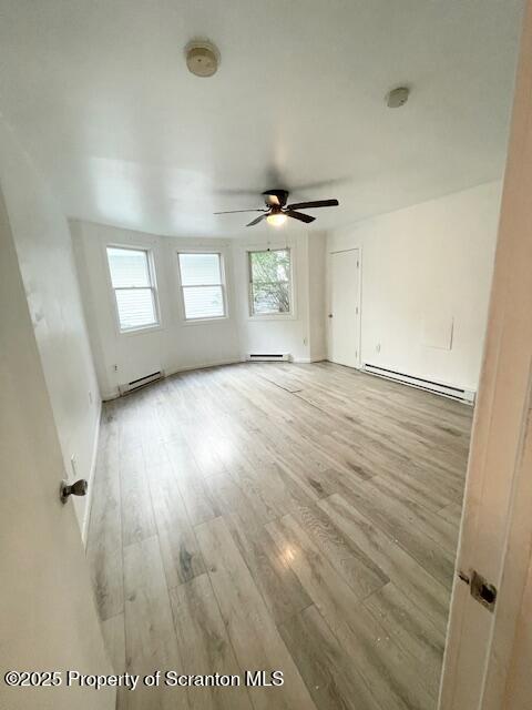 611 South Webster Avenue, Unit 1 Scranton, PA 18505 - Photo 6 of 9 an empty room with wooden floor and windows