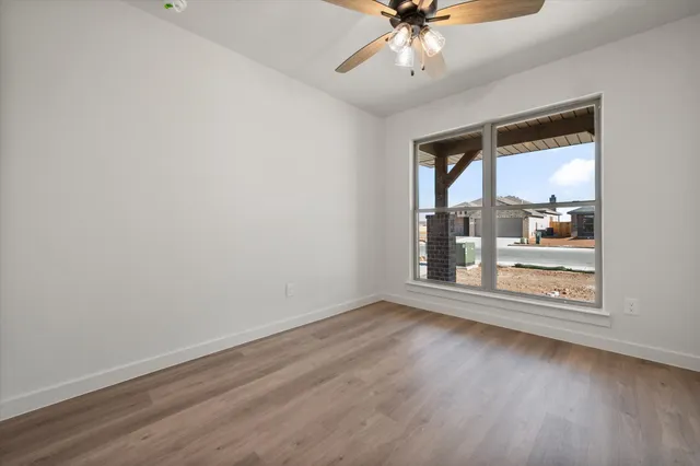 a bathroom with a granite countertop toilet a sink and a bathtub