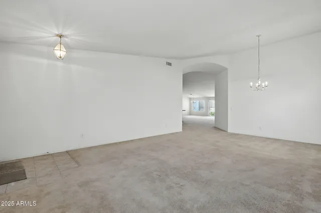 a large kitchen with stainless steel appliances granite countertop a stove and cabinets