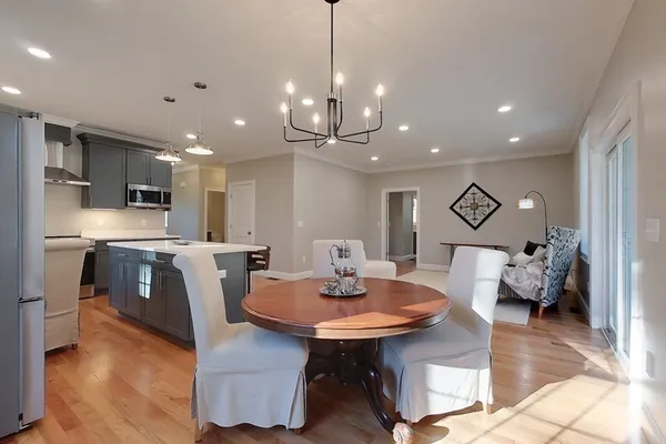 a view of a dining room with furniture and wooden floor
