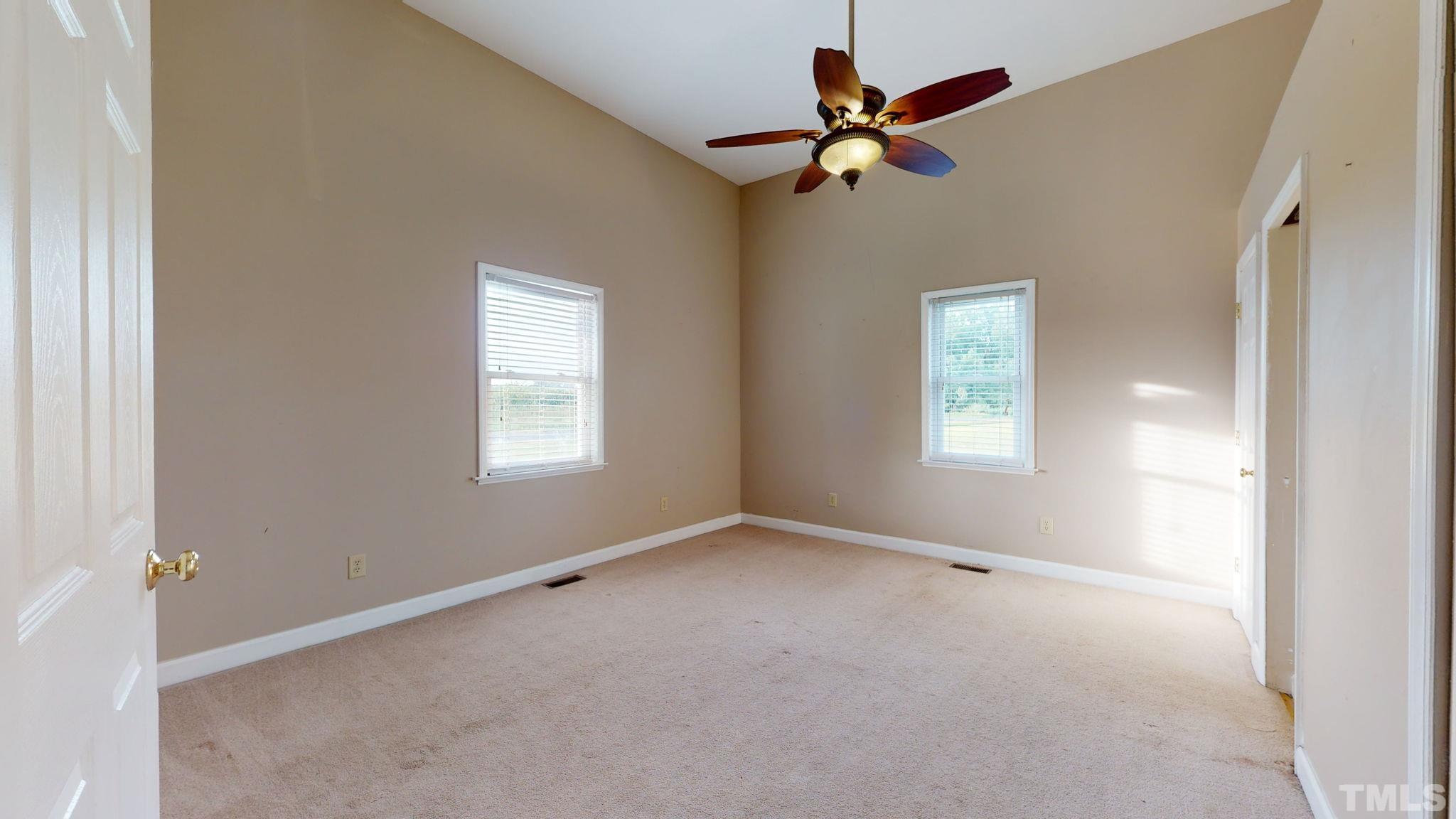 720 Mitchell Road Angier, NC 27501 - Photo 19 of 25 a view of room with a ceiling fan and window