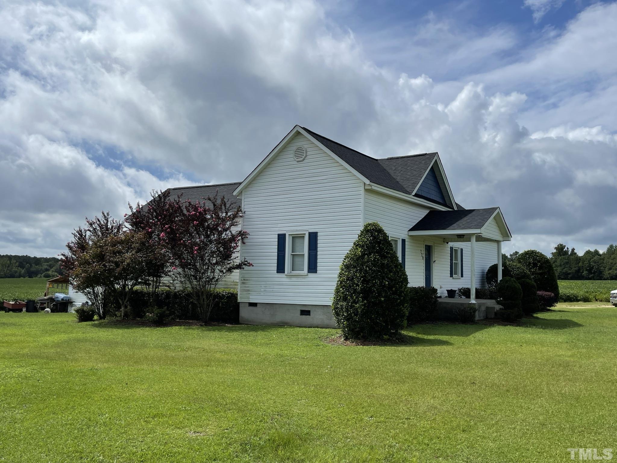 720 Mitchell Road Angier, NC 27501 - Photo 3 of 25 a house view with a garden space