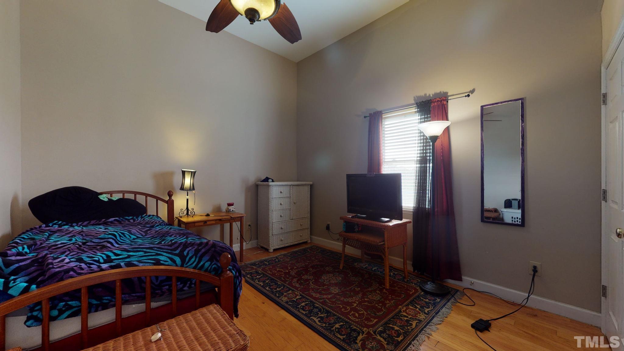 720 Mitchell Road Angier, NC 27501 - Photo 22 of 25 a bedroom with furniture and a window
