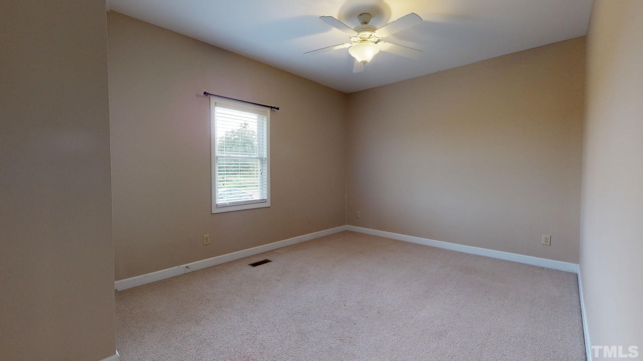 720 Mitchell Road Angier, NC 27501 - Photo 24 of 25 an empty room with a window