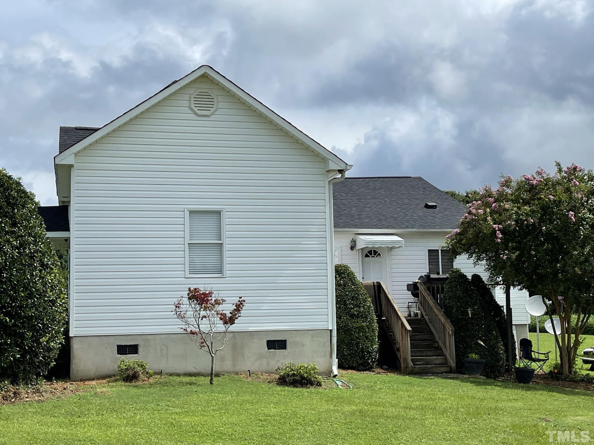 720 Mitchell Road Angier, NC 27501 - Photo 5 of 25 a view of a house with backyard