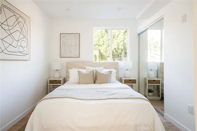 a bed room with a bed and a window