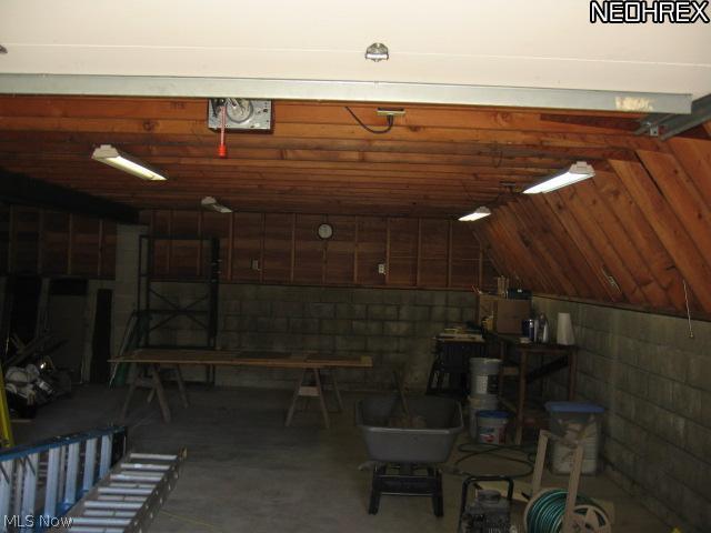 361 Abbyshire Road Akron, OH 44319 - Photo 4 of 25 INTERIOR SHOT OF OUTBUILDING - ONE BAY - ADDL STORAGE/SAME SIZE TO LEFT OF CENTER WALL SUPPORT