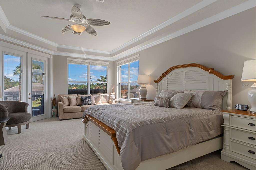 1601 North Tee Time Terrace Hernando, FL 34442 - Photo 42 of 69 a bedroom with a large bed and ceiling fan