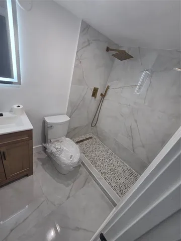 an empty room with a fan and a fan