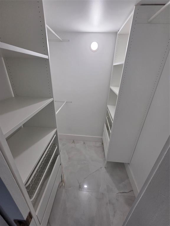 251 South Cypress Road, Unit 101 Pompano Beach, FL 33060 - Photo 21 of 41 a view of an empty walk in closet