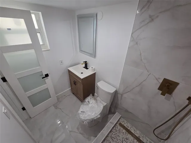 a bathroom with a sink and toilet