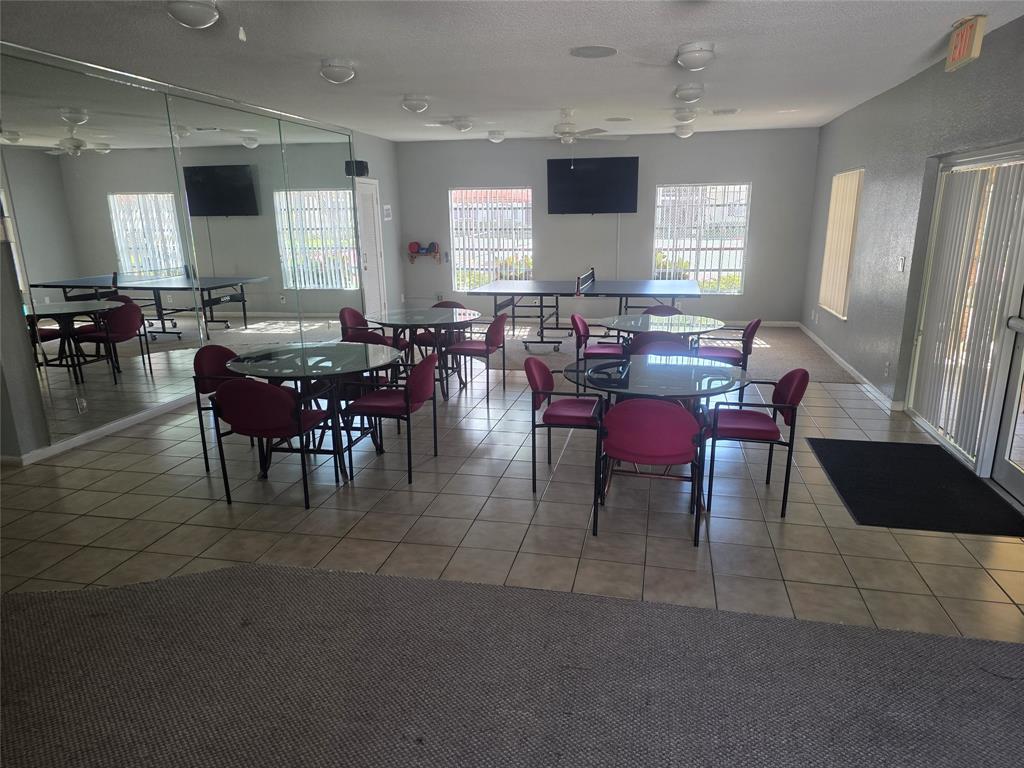 251 South Cypress Road, Unit 101 Pompano Beach, FL 33060 - Photo 37 of 41 a view of a dining room with furniture and window