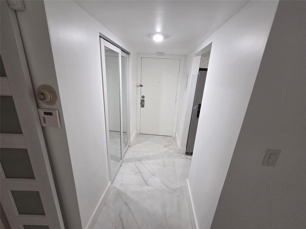 251 South Cypress Road, Unit 101 Pompano Beach, FL 33060 - Photo 4 of 41 a view of a hallway