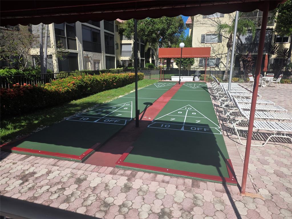 251 South Cypress Road, Unit 101 Pompano Beach, FL 33060 - Photo 41 of 41 a view of a house with a yard