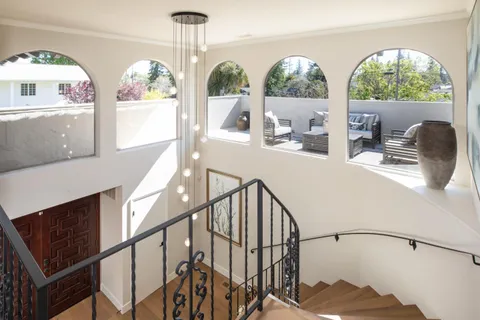 a view of living room with furniture and windows