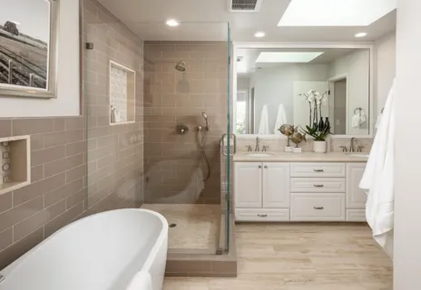 a bathroom with a sink a toilet and shower
