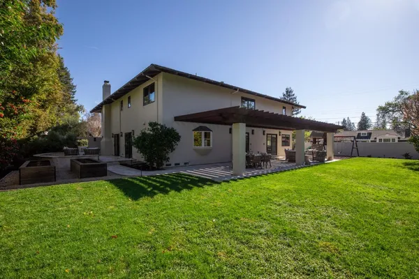 a view of a house with a yard porch and sitting area