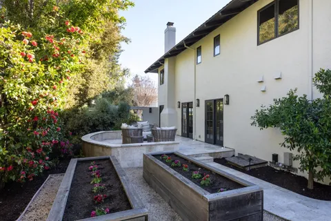 a view of a two chairs in the balcony