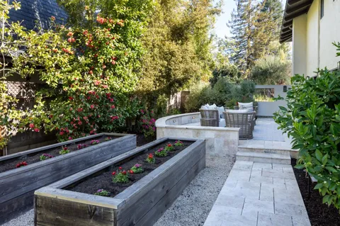 a view of a patio with couches and a fire pit