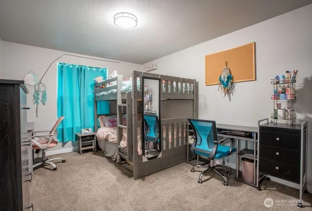 a bedroom with furniture and a window