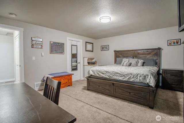 a bed room with a bed and a couch