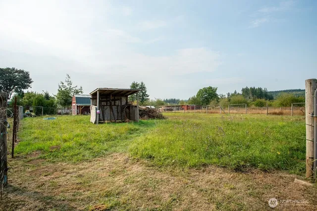 a view of a garden with a building in the background