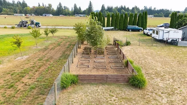 a view of a lake with couches chairs