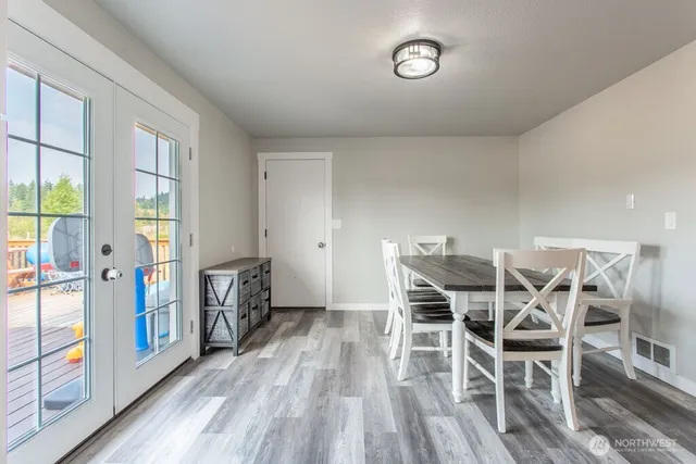 a view of a dining room with furniture and a table