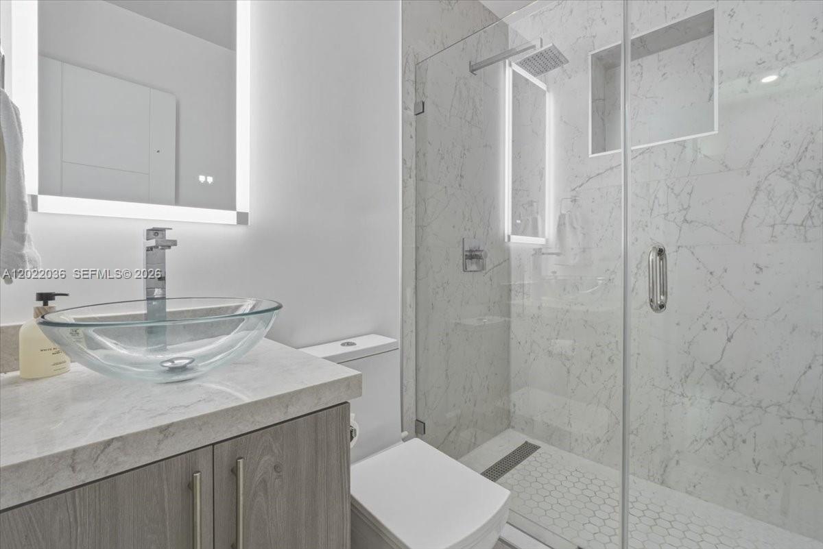 120 West 50th Street Hialeah, FL 33012 - Photo 12 of 22 a bathroom with a sink toilet and shower