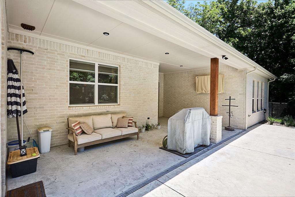 358 Glade Valley Road Azle, TX 76020 - Photo 29 of 35 Covered patio area featuring light-colored brick exterior, recessed lighting, and a substantial wood support pillar