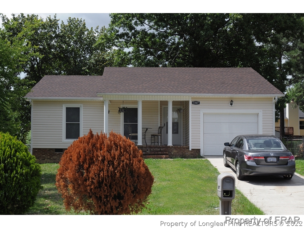 3307 Arrowhead Road Spring Lake, NC 28390 - Photo 1 of 15 a house view with a garden space